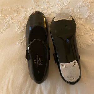 Little girl tap shoes.  Never worn.